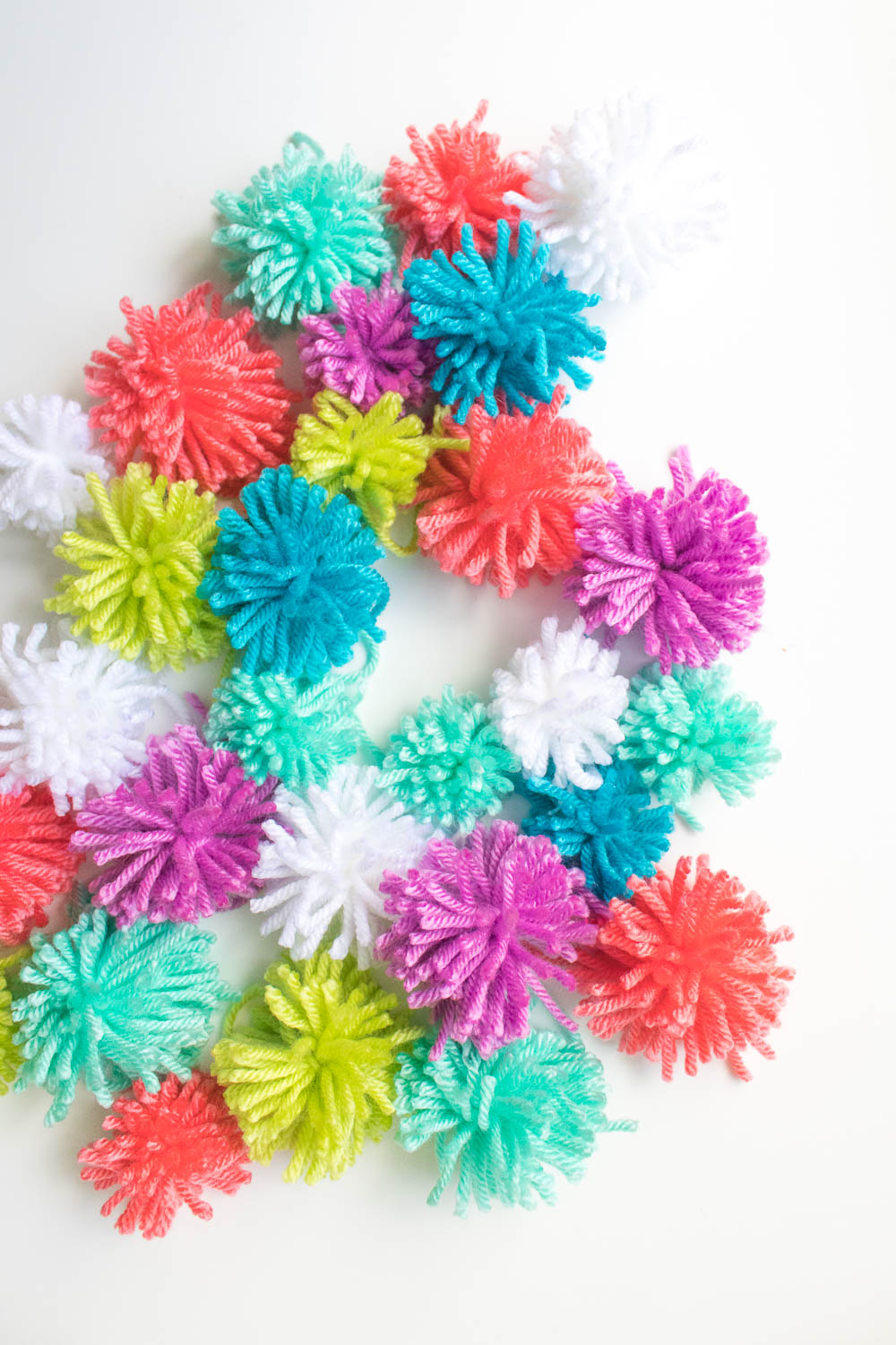 DIY RIBBON & POM POM STRAW CLUTCH - Showit Blog