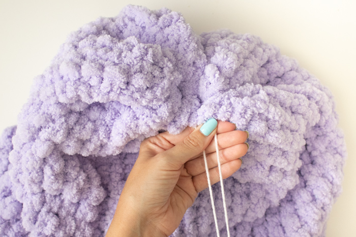Easy DIY! How to Finger Knit a Floor Pouf | Club Crafted