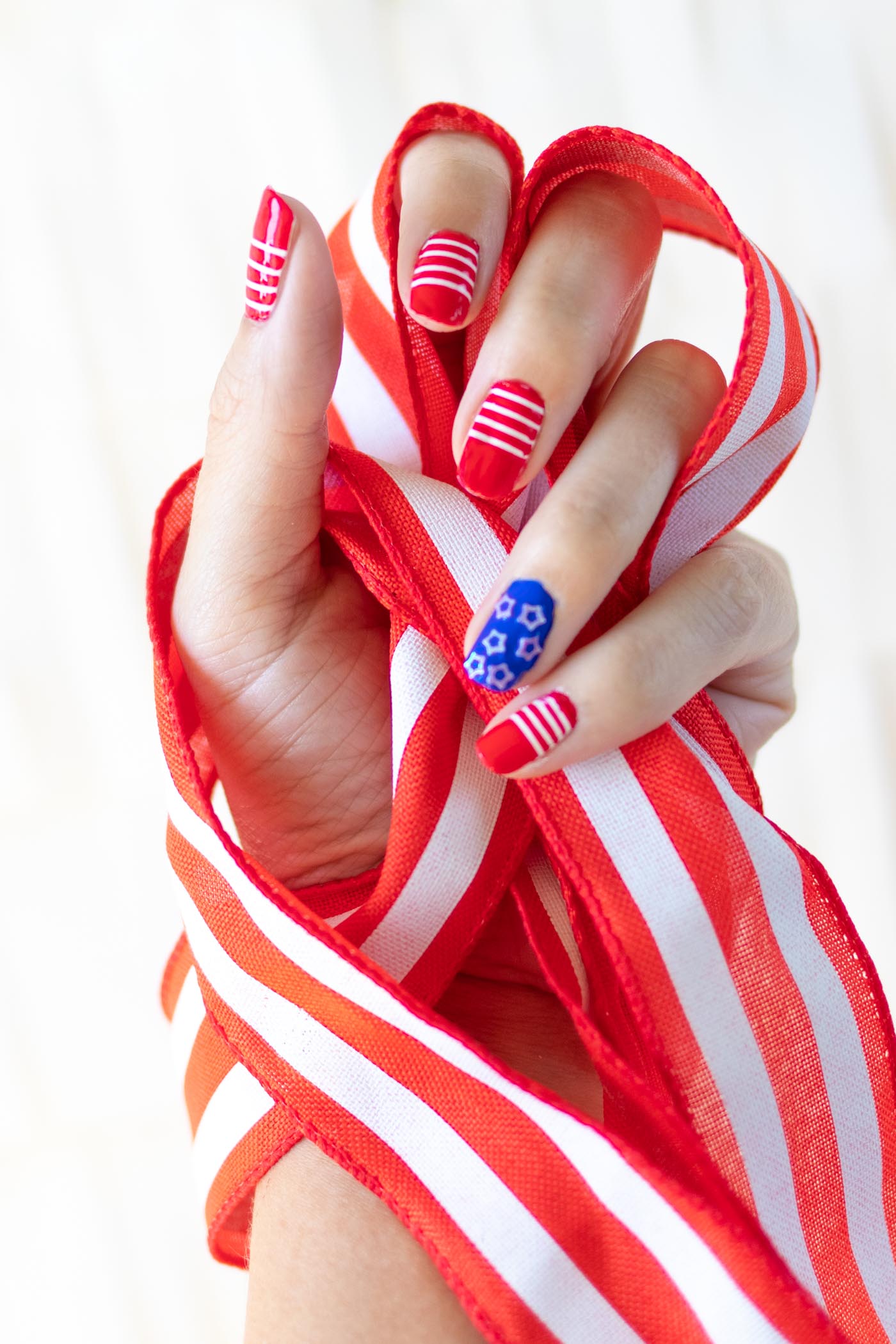Try these simple 4th of July nails! Give yourself a DIY manicure for Independence Day with your favorite nail polishes! // #4thofjuly #nailideas #manicure #nailpolish #diybeauty