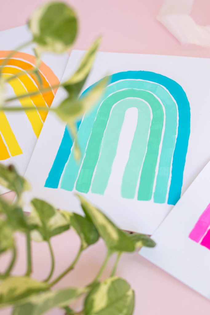 5-Minute Wall Art Idea! DIY Monochromatic Rainbow Art // Decorate with simple hand-painted monochromatic rainbows to make custom wall art in minutes! #wallart #homedecor #rainbows #papercrafts #cardstock #painting #monochromatic