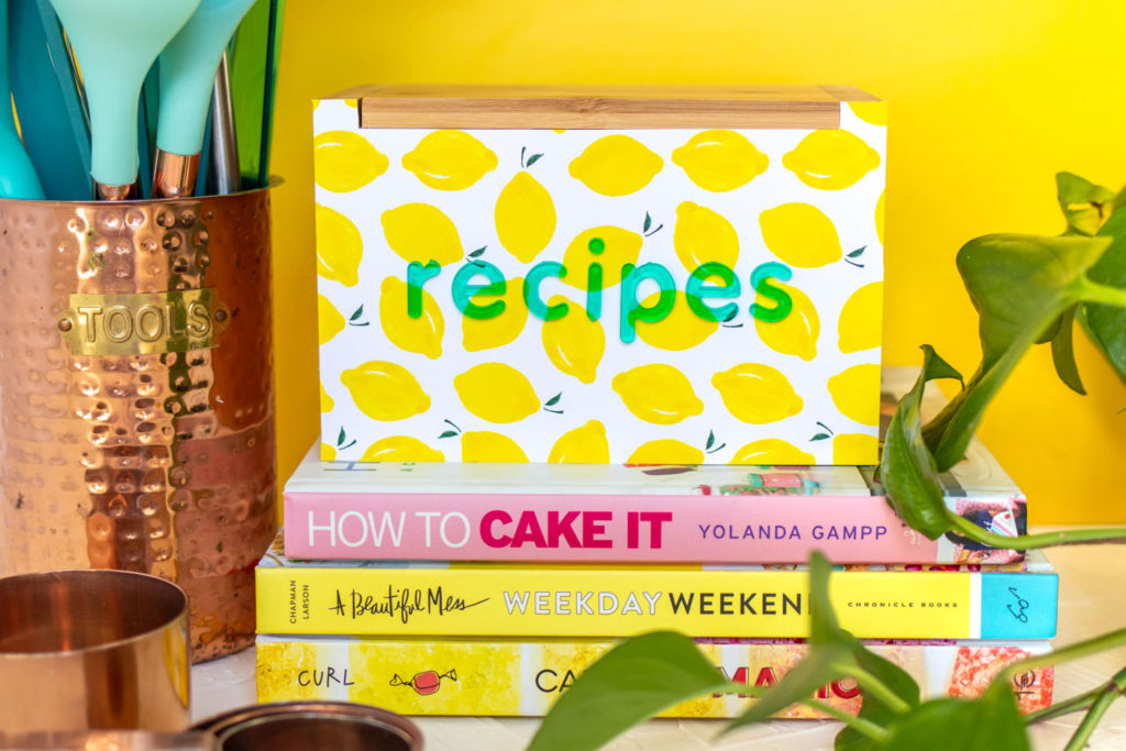DIY Recipe Box Makeover with Wallpaper // Use removable wallpaper to makeover a simple wood recipe box! Add printable recipe cards and cute dividers to organize recipes in style! #diyideas #homedecor #recipecards #papercrafts #wallpaper #easydiy #giftideas #diygifts #diystorage #storageideas