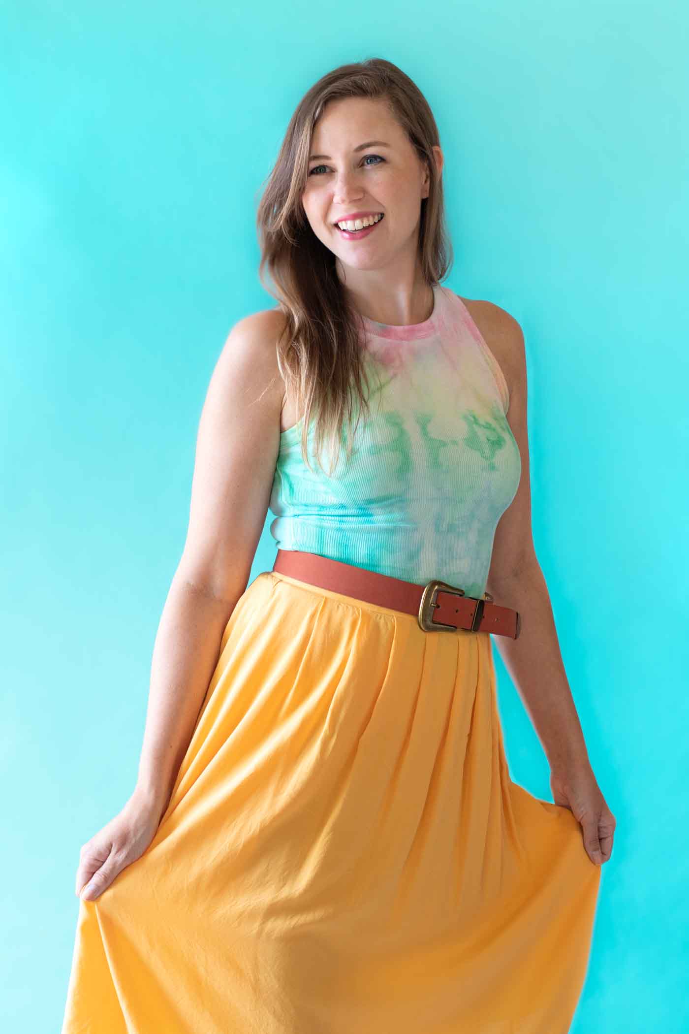 How to Tie Dye with Fabric Paint // See how to create tie dye with soft fabric paint by Tulip! #ad Make tie dye patterns on any fabric with just paint and water. Click through for the full video! #tiedye #dyeing #fabric #painting #fabricpaint #summerdiy #fashiondiy #tshirt