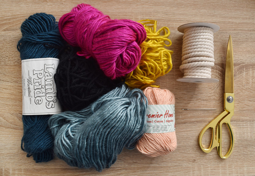 DIY Mini Yarn Wrapped Rope Bowl // Make a mini bowl to organize small items like clips and pins around the house with this cute DIY bowl by Faith of @designfixation! Wrap rope with your favorite colors of yarn to make a rope bowl that fits in anywhere! #bowl #storagediy #organization #ropebowl #yarncrafts #fiberart #fibercrafts #homeoffice #officediy #homedecor #diydecor