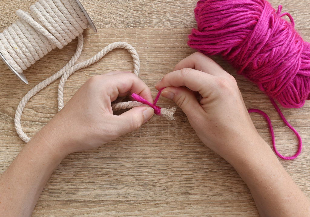 DIY Mini Yarn Wrapped Rope Bowl // Make a mini bowl to organize small items like clips and pins around the house with this cute DIY bowl by Faith of @designfixation! Wrap rope with your favorite colors of yarn to make a rope bowl that fits in anywhere! #bowl #storagediy #organization #ropebowl #yarncrafts #fiberart #fibercrafts #homeoffice #officediy #homedecor #diydecor
