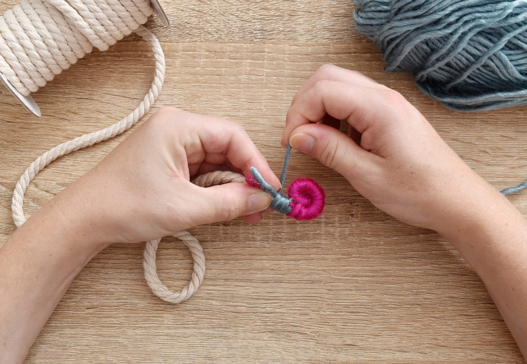 DIY Mini Yarn Wrapped Rope Bowl // Make a mini bowl to organize small items like clips and pins around the house with this cute DIY bowl by Faith of @designfixation! Wrap rope with your favorite colors of yarn to make a rope bowl that fits in anywhere! #bowl #storagediy #organization #ropebowl #yarncrafts #fiberart #fibercrafts #homeoffice #officediy #homedecor #diydecor