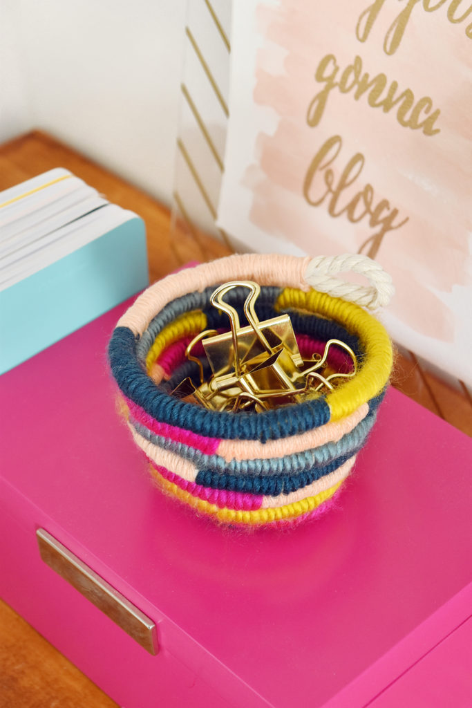 DIY Mini Yarn Wrapped Rope Bowl // Make a mini bowl to organize small items like clips and pins around the house with this cute DIY bowl by Faith of @designfixation! Wrap rope with your favorite colors of yarn to make a rope bowl that fits in anywhere! #bowl #storagediy #organization #ropebowl #yarncrafts #fiberart #fibercrafts #homeoffice #officediy #homedecor #diydecor