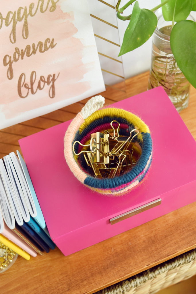 DIY Mini Yarn Wrapped Rope Bowl // Make a mini bowl to organize small items like clips and pins around the house with this cute DIY bowl by Faith of @designfixation! Wrap rope with your favorite colors of yarn to make a rope bowl that fits in anywhere! #bowl #storagediy #organization #ropebowl #yarncrafts #fiberart #fibercrafts #homeoffice #officediy #homedecor #diydecor