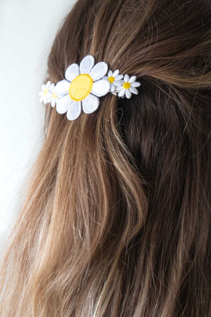 DIY Floral Patch Barrette for your Hair // Try this 5-minute DIY for updating a hair barrette with iron-on patches! I bet you didn't know there were more uses for iron-on patches than decorating your fav denim jacket! #hairstyle #hairpin #beautydiy #diystyle #patches #90sstyle #womensfashion #diyfashion #hairideas