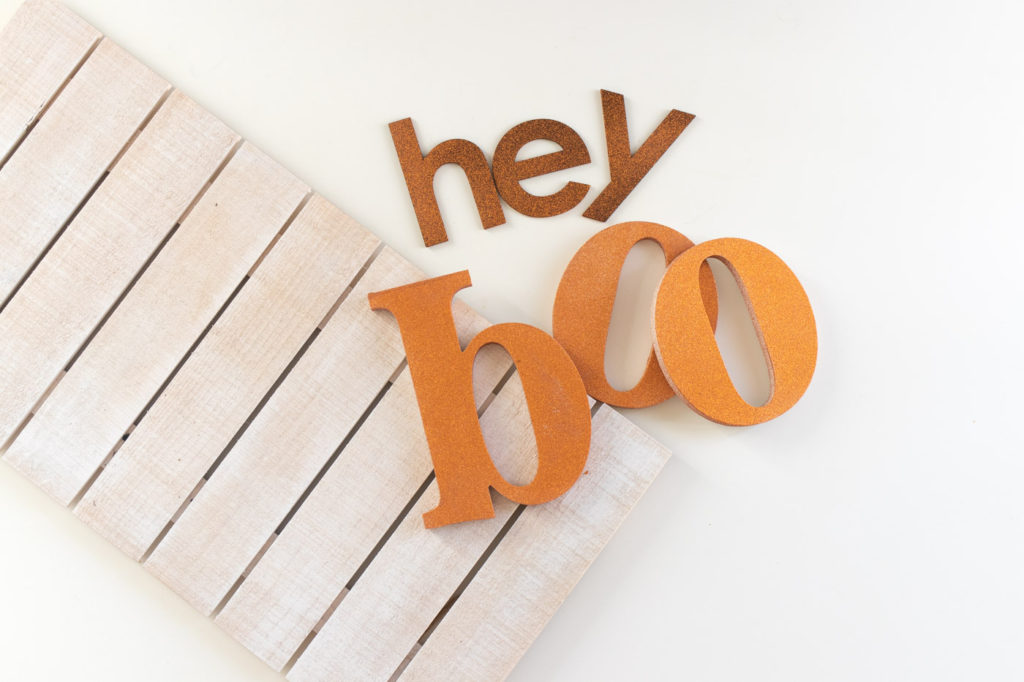 "Hey Boo" Punny Halloween Sign DIY // Make a fun wooden Halloween sign with a punny saying to decorate your home for Halloween! Decorate your front door, fireplace or other corner of your home using supplies from @joann given a makeover with the NEW @rustoleum Imagine collection, including glitter spray paint #ad #handmadewithjoann #halloween #halloweendiy #homedecor #halloweendecor #painting #spraypaint
