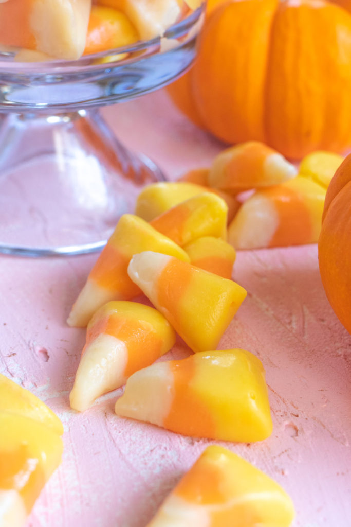 Easy Candy Corn Fudge // Make white chocolate fudge with honey that looks just like pieces of candy corn! This 3-ingredient fudge is the perfect Halloween treat for kids and adults! #candycorn #candy #fudgerecipes #whitechocolate #halloweensnacks #fallsnacks #fall #halloween #halloweentreats
