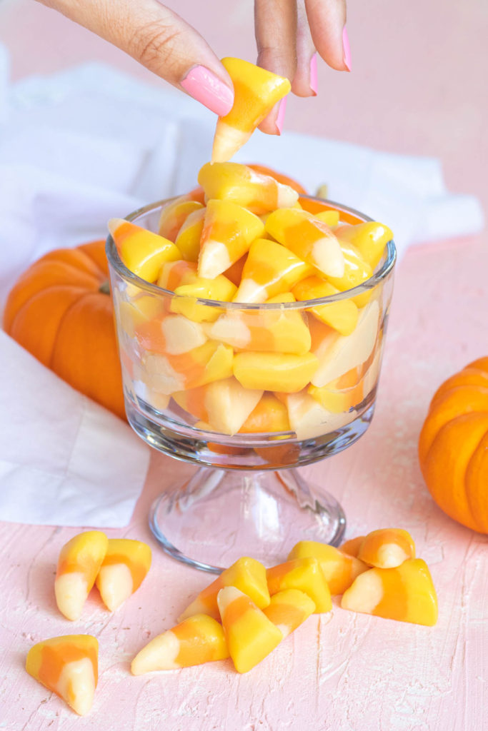 Easy Candy Corn Fudge // Make white chocolate fudge with honey that looks just like pieces of candy corn! This 3-ingredient fudge is the perfect Halloween treat for kids and adults! #candycorn #candy #fudgerecipes #whitechocolate #halloweensnacks #fallsnacks #fall #halloween #halloweentreats