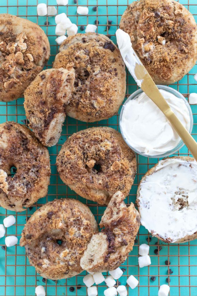Homemade S'mores Bagels // Make a batch of sweet, buttery smores bagels with a yeast bagel base, chocolate chunks and a gooey marshmallow graham cracker topping! These are the perfect sweet breakfast treat for kids and adults! #bagels #yeastdough #breadrecipes #recipes #breakfast #smores #breakfastrecipes #brunchrecipes
