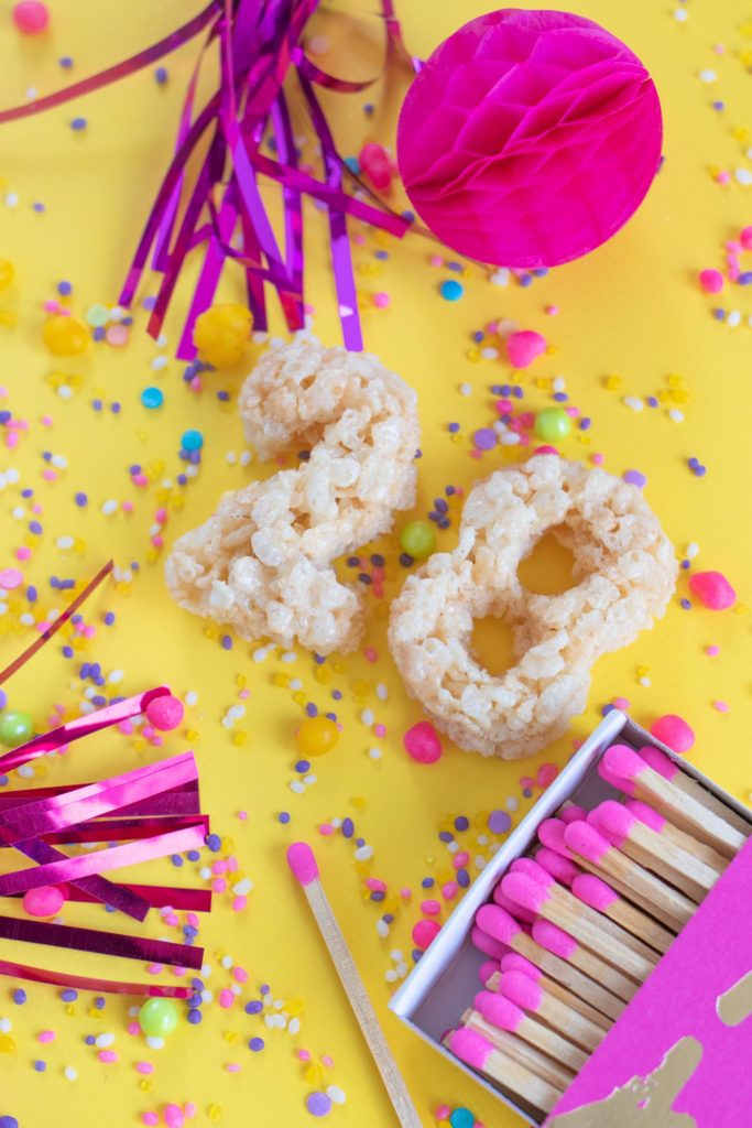 Number Rice Krispies Treats for Birthdays // Celebrate any occasion with a party treat for kids AND adults! Use cookie cutters to cut numbers from homemade rice krispies treats to celebrate birthdays! #ricekrispies #snacks #birthdayparty #birthday #partyfood #cereal #snackrecipes #easyrecipes