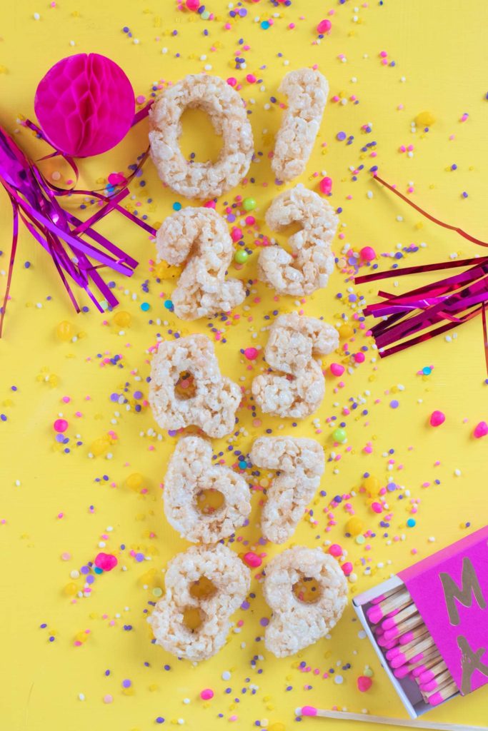 Number Rice Krispies Treats for Birthdays // Celebrate any occasion with a party treat for kids AND adults! Use cookie cutters to cut numbers from homemade rice krispies treats to celebrate birthdays! #ricekrispies #snacks #birthdayparty #birthday #partyfood #cereal #snackrecipes #easyrecipes