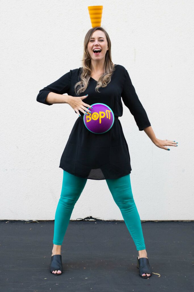 DIY Bop It! Costume // Recreate the classic 90s toy Bop It! with a few simple supplies! This easy 90s toy costume is the perfect nostalgic costume for adults! #costume #halloween #90s #toycostume #adultcostume #halloweencostume #diycostume