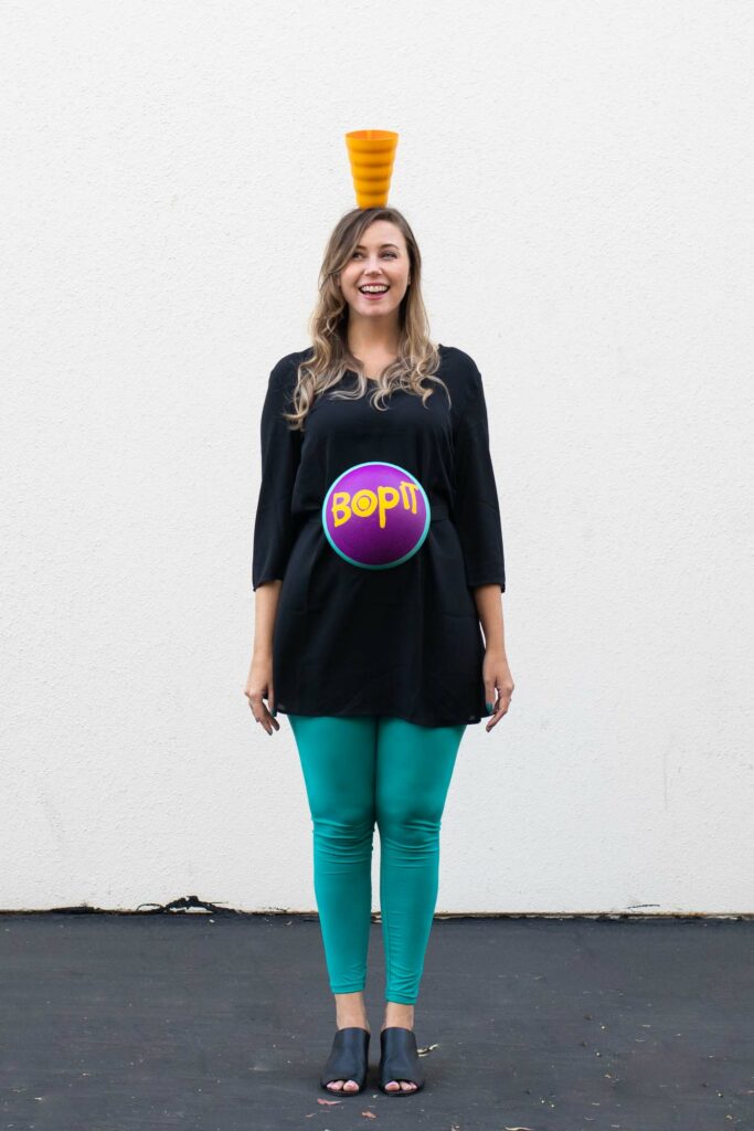 DIY Bop It! Costume // Recreate the classic 90s toy Bop It! with a few simple supplies! This easy 90s toy costume is the perfect nostalgic costume for adults! #costume #halloween #90s #toycostume #adultcostume #halloweencostume #diycostume