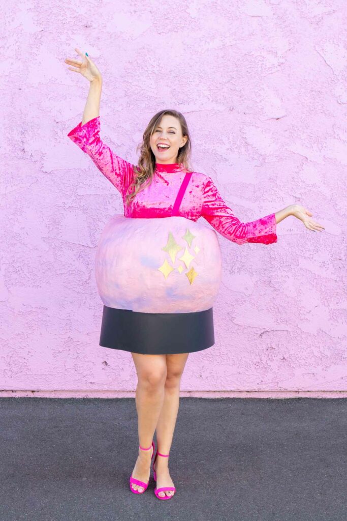 DIY Crystal Ball Costume for Halloween // Use paper mache on a large balloon to create a DIY halloween costume that looks like a mystical crystal ball used by a fortune teller! #crystalball #papermache #halloween #costume #kidscostume #adultcostume