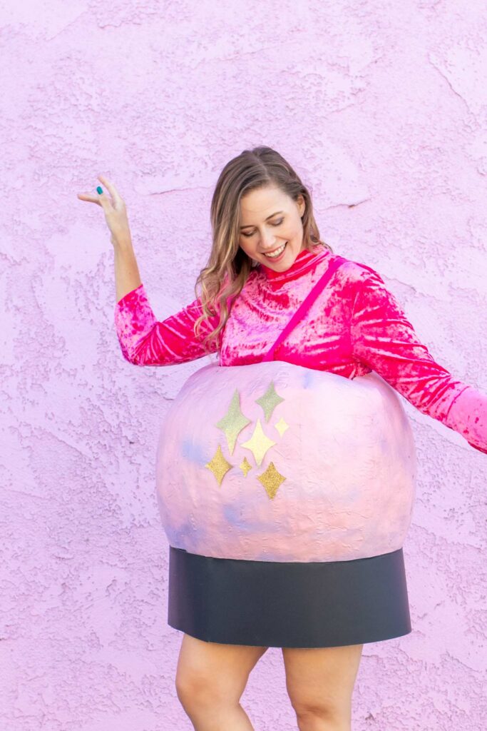 DIY Crystal Ball Costume for Halloween // Use paper mache on a large balloon to create a DIY halloween costume that looks like a mystical crystal ball used by a fortune teller! #crystalball #papermache #halloween #costume #kidscostume #adultcostume