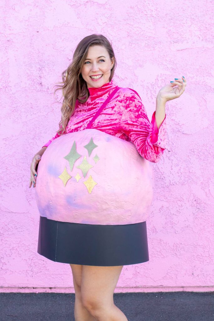 DIY Crystal Ball Costume for Halloween // Use paper mache on a large balloon to create a DIY halloween costume that looks like a mystical crystal ball used by a fortune teller! #crystalball #papermache #halloween #costume #kidscostume #adultcostume