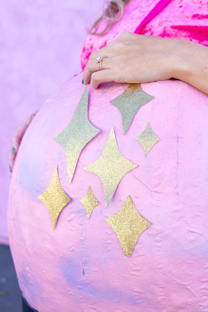 DIY Crystal Ball Costume for Halloween // Use paper mache on a large balloon to create a DIY halloween costume that looks like a mystical crystal ball used by a fortune teller! #crystalball #papermache #halloween #costume #kidscostume #adultcostume