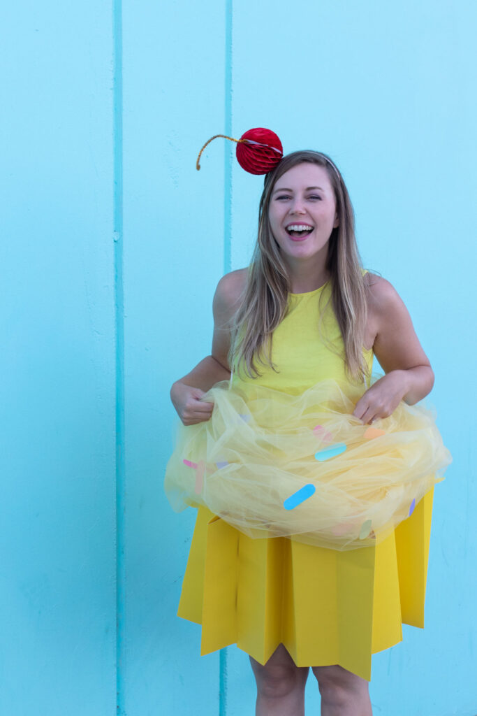 DIY Cupcake Costume for Halloween // Make yourself into a cupcake for Halloween with this fun DIY costume for kids or adults using poster board and tulle! #diycostume #halloween #kidscostumes #adultcostumes #cupcake #halloweendiy #halloweencostume