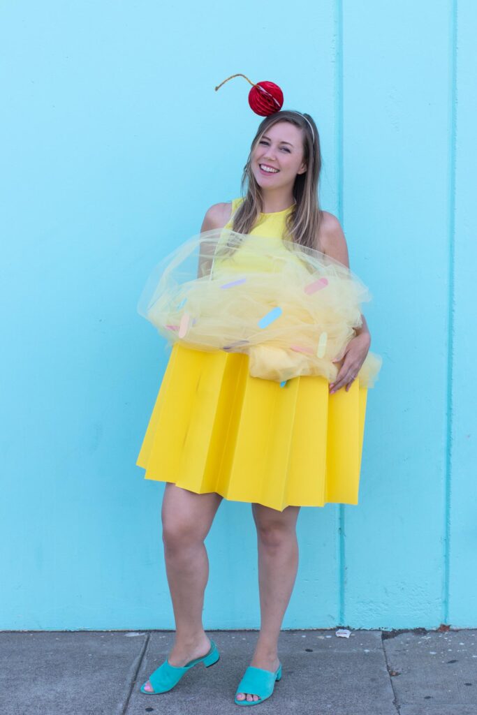 DIY Cupcake Costume for Halloween // Make yourself into a cupcake for Halloween with this fun DIY costume for kids or adults using poster board and tulle! #diycostume #halloween #kidscostumes #adultcostumes #cupcake #halloweendiy #halloweencostume