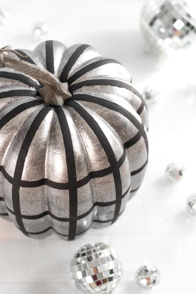 DIY Disco Ball Pumpkin Painting Idea! See how to paint pumpkins to look like sparkly disco balls for decorate for fall and Halloween! #halloween #falldecor #pumpkins #painting #discoball #diyhalloween #falldiy