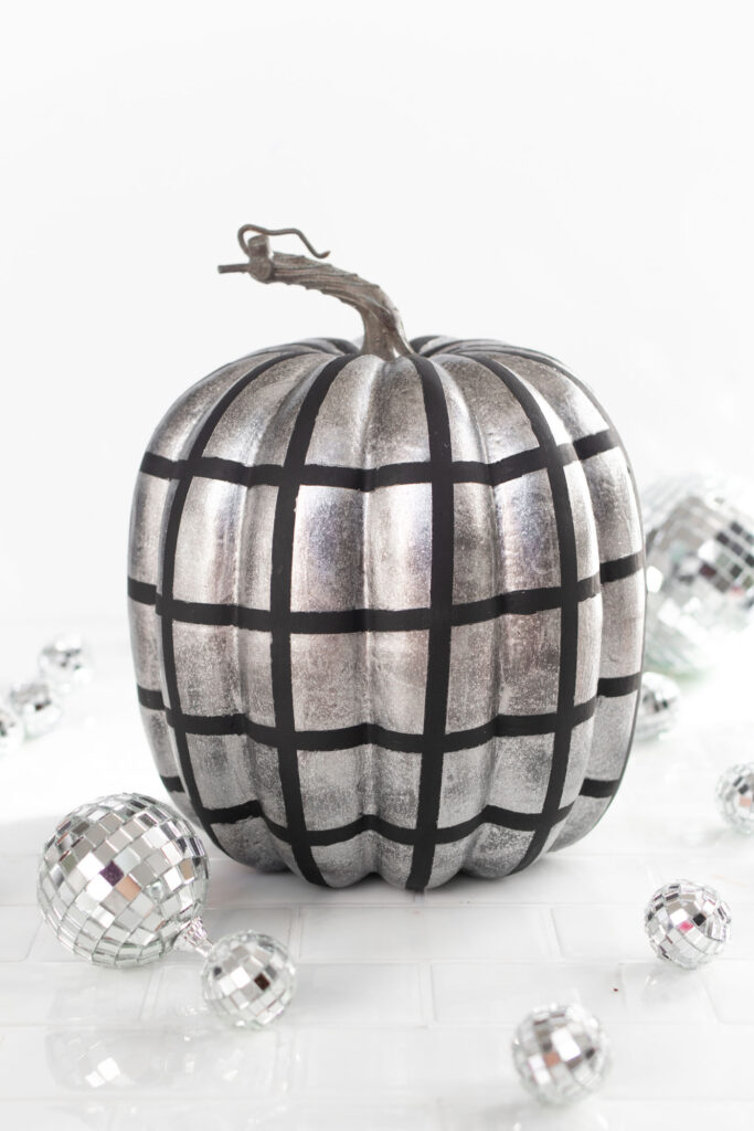 DIY Disco Ball Pumpkin Painting Idea! See how to paint pumpkins to look like sparkly disco balls for decorate for fall and Halloween! #halloween #falldecor #pumpkins #painting #discoball #diyhalloween #falldiy