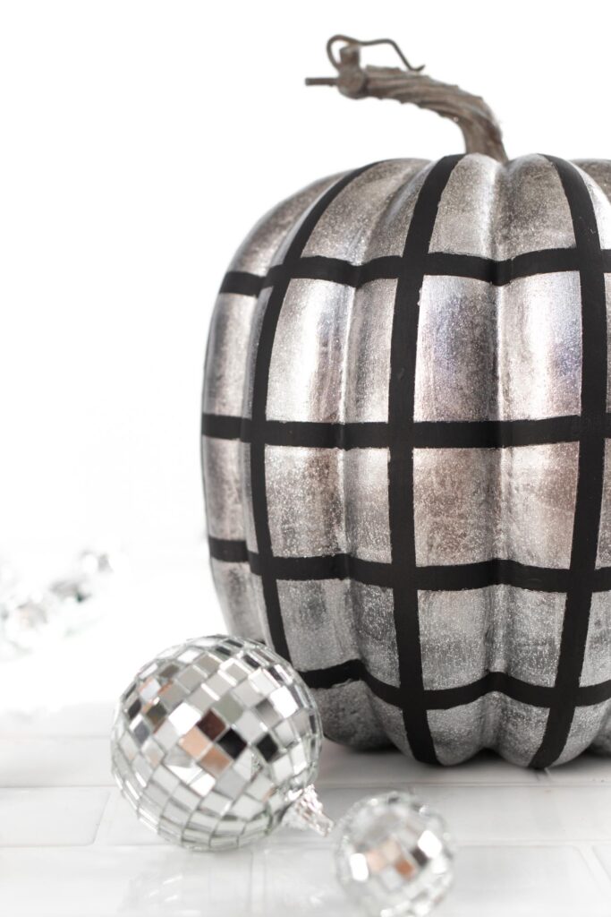 DIY Disco Ball Pumpkin Painting Idea! See how to paint pumpkins to look like sparkly disco balls for decorate for fall and Halloween! #halloween #falldecor #pumpkins #painting #discoball #diyhalloween #falldiy