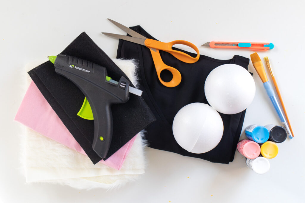 DIY Furby Costume // 90s Toy Costume / Dress up as the classic Furby toy from the 90s with this no-sew Halloween costume! Use faux fur and foam spheres to create a Furby face #halloween #costume #diyhalloween #90s #halloweencostume #furby #dresscostume #nosew