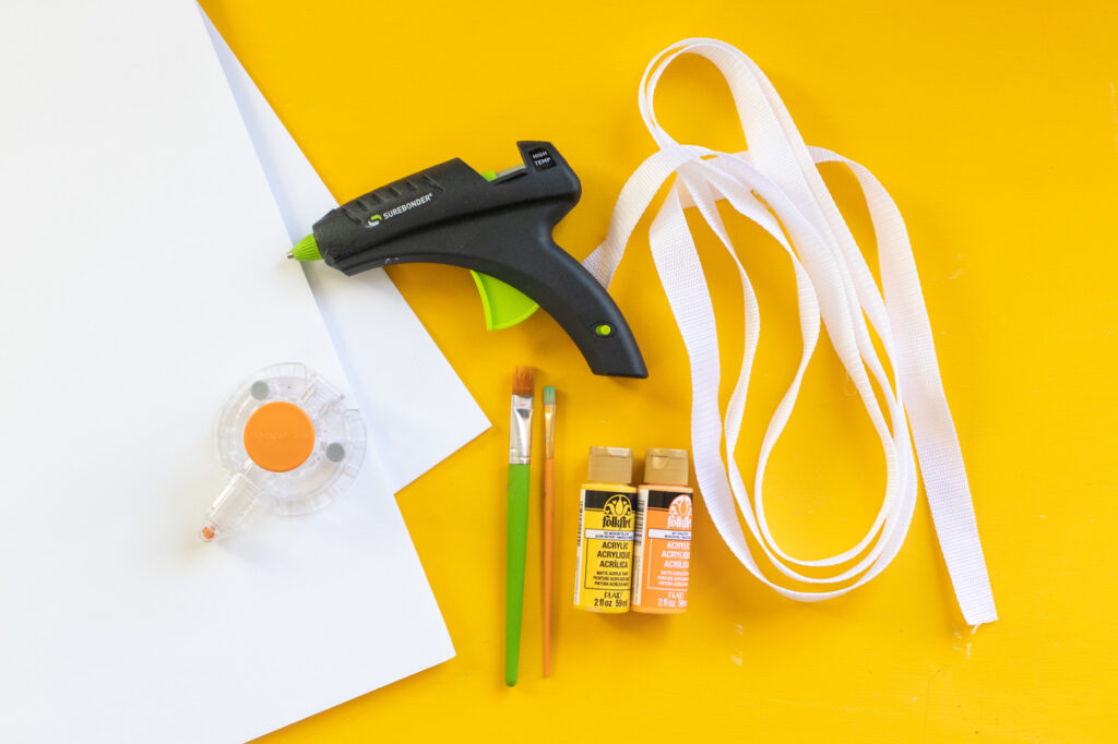 DIY Easy Cheese Costume (Cheeseboard Costume) // Use poster board to make a fun cheesy costume complete with a wedge of cheese headband! This easy last-minute costume is perfect for kids or adults to wear this Halloween #costume #easycostume #diycostume #halloween #adultcostumes #kidscostumes #cheese #posterboard
