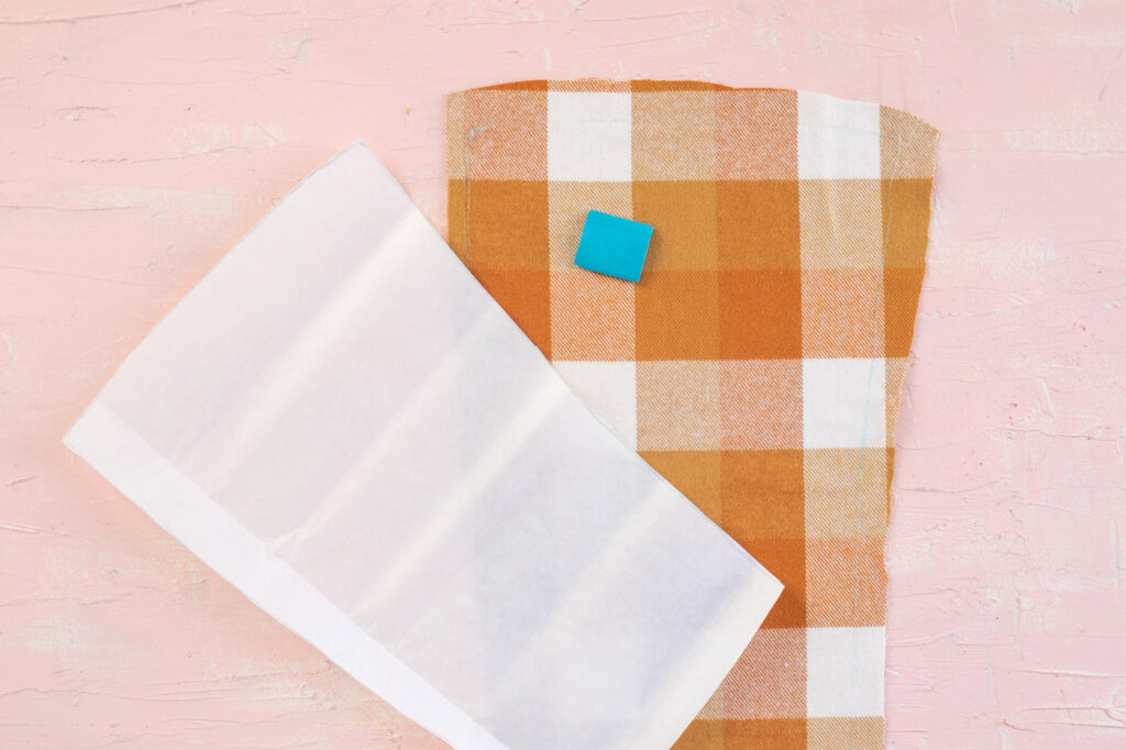 DIY No-Sew Plaid Jacket Insert // Update a denim jacket with varieties of plaid flannel on the back! This no-sew jacket idea is perfect for fall fashion! #joannpartner #handmadewithjoann #nosew #fallfashion #womensfashion #fabriccrafts