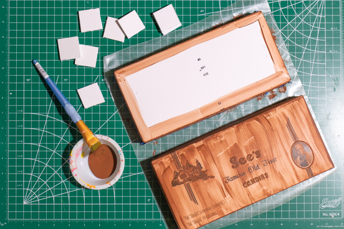 DIY Chocolate Box Makeover for Valentine's Day // Turn a plain box of chocolate into a giant chocolate bar with poster board and paint! This oversized chocolate box makes a fun just-because gift or a DIY valentine! #valentinesday #vday #diyvalentine #paint #posterboard #papercrafts #giftideas