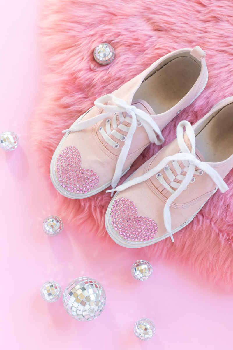 DIY Crystal Valentine's Day Shoes // Makeover old sneakers with colored crystals or rhinestones using Aleene's The Ultimate glue! This easy shoe update is perfect for Valentine's Day or any day of the year! #ad #shoemakeover #upcycle #stylediy #diystyle #shoediy #easydiy #diysforteens #craftsforteens #valentinesday #valentinesdaydiy #vdaydiy