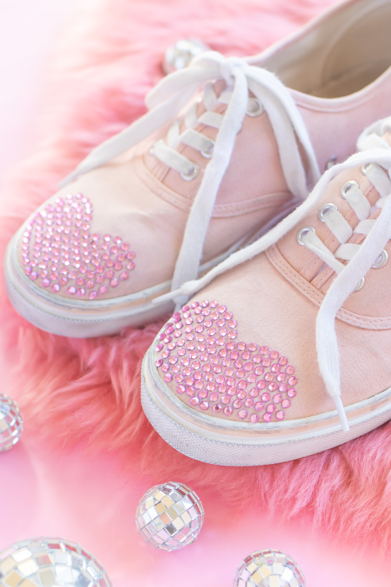DIY Crystal Valentine's Day Shoes // Makeover old sneakers with colored crystals or rhinestones using Aleene's The Ultimate glue! This easy shoe update is perfect for Valentine's Day or any day of the year! #ad #shoemakeover #upcycle #stylediy #diystyle #shoediy #easydiy #diysforteens #craftsforteens #valentinesday #valentinesdaydiy #vdaydiy