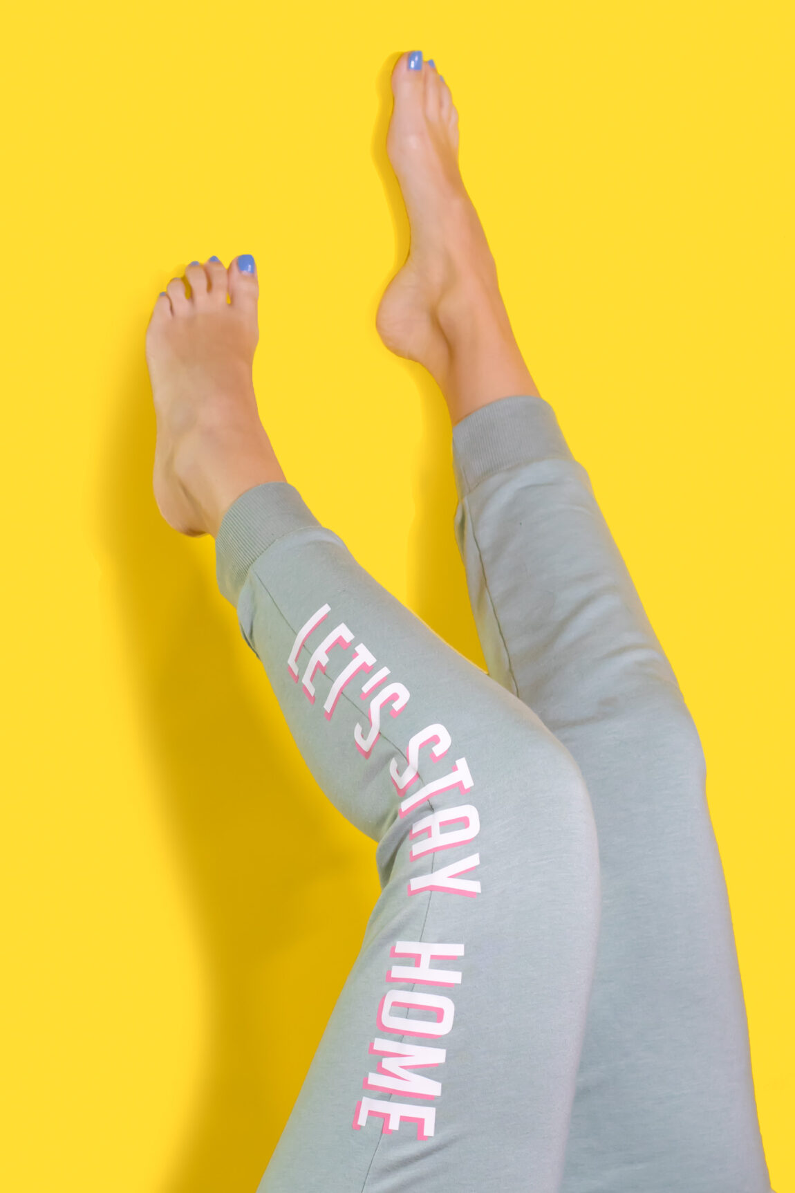 "Let's Stay Home" DIY Graphic Sweatpants with Iron-On Vinyl (Cricut) // Update a pair of plain sweats with a cute saying using vinyl! #cricutmade #ironon #vinyl #fashion #diyfashion #nosew #sweatpants #womensstyle #stylediy