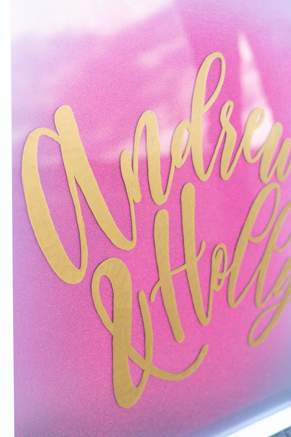 Easy DIY Calligraphy Wedding Sign // Use a large photo frame to make your own custom wedding signage with Rust-Oleum spray paints! Trace your names or sayings, then let it pop off the glass with the new Imagine collection of glitter spray paint available at @joann! #ad #handmadewithjoann #weddingdiy #diywedding #weddingsign #spraypainting #calligraphy #diyideas #homedecor