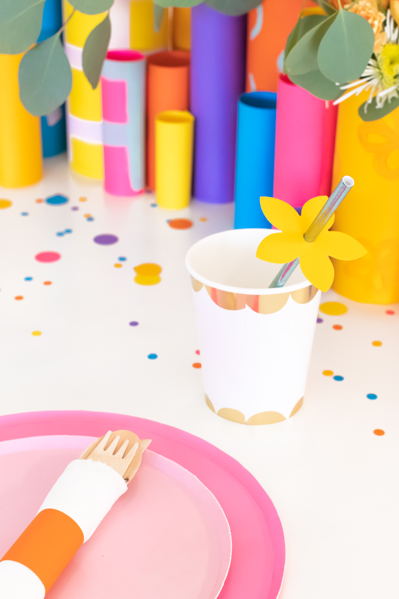 Colorful Spring Party with DIY Paper Decor / Use vibrant Astrobrights cardstock to create a variety of paper party decor for a spring celebration! Whether you're celebrating a Mother's Day brunch, bachelorette weekend or just-because party, thes bright spring party ideas will POP! Make paper wrapped vases as a unique centerpiece accompanied by a paper floral chandelier, floral straws, paper napkin rings and simple homemade confetti #ad #partyideas #springdecor #papercrafts #diyparty #partydecor #paperparty #paperdecor #mothersday #easterbrunch #rainbowparty #floraldecor #birthdayparty #springparty