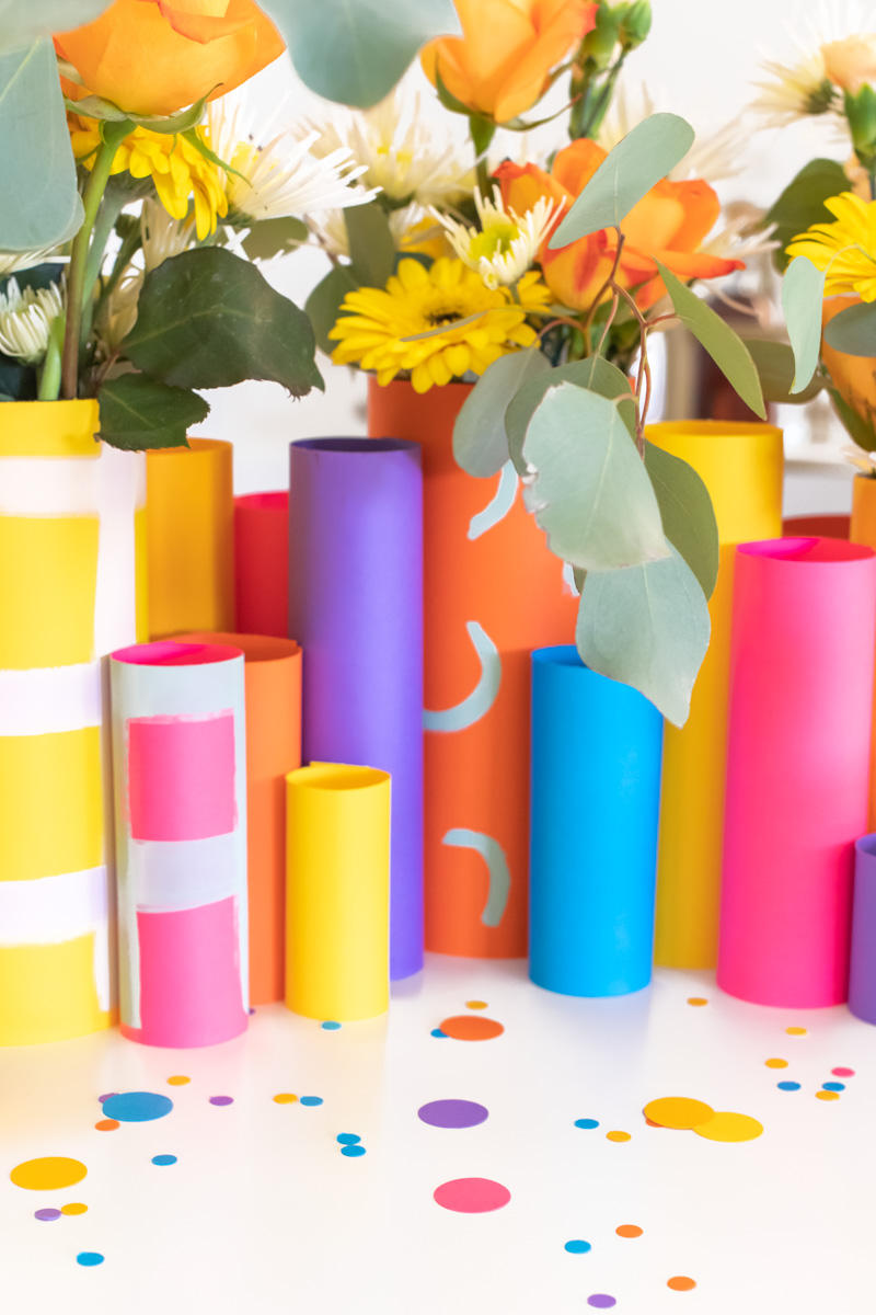 Colorful Spring Party with DIY Paper Decor / Use vibrant Astrobrights cardstock to create a variety of paper party decor for a spring celebration! Whether you're celebrating a Mother's Day brunch, bachelorette weekend or just-because party, thes bright spring party ideas will POP! Make paper wrapped vases as a unique centerpiece accompanied by a paper floral chandelier, floral straws, paper napkin rings and simple homemade confetti #ad #partyideas #springdecor #papercrafts #diyparty #partydecor #paperparty #paperdecor #mothersday #easterbrunch #rainbowparty #floraldecor #birthdayparty #springparty