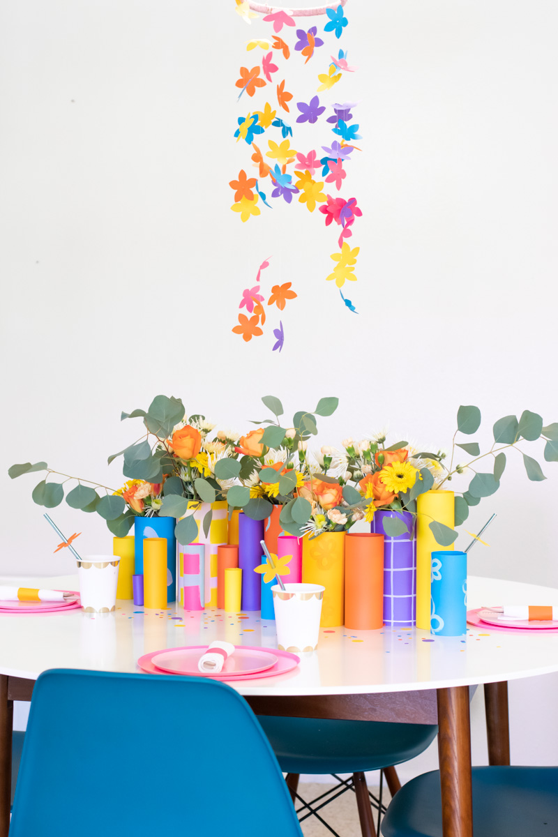 Colorful Spring Party with DIY Paper Decor / Use vibrant Astrobrights cardstock to create a variety of paper party decor for a spring celebration! Whether you're celebrating a Mother's Day brunch, bachelorette weekend or just-because party, thes bright spring party ideas will POP! Make paper wrapped vases as a unique centerpiece accompanied by a paper floral chandelier, floral straws, paper napkin rings and simple homemade confetti #ad #partyideas #springdecor #papercrafts #diyparty #partydecor #paperparty #paperdecor #mothersday #easterbrunch #rainbowparty #floraldecor #birthdayparty #springparty