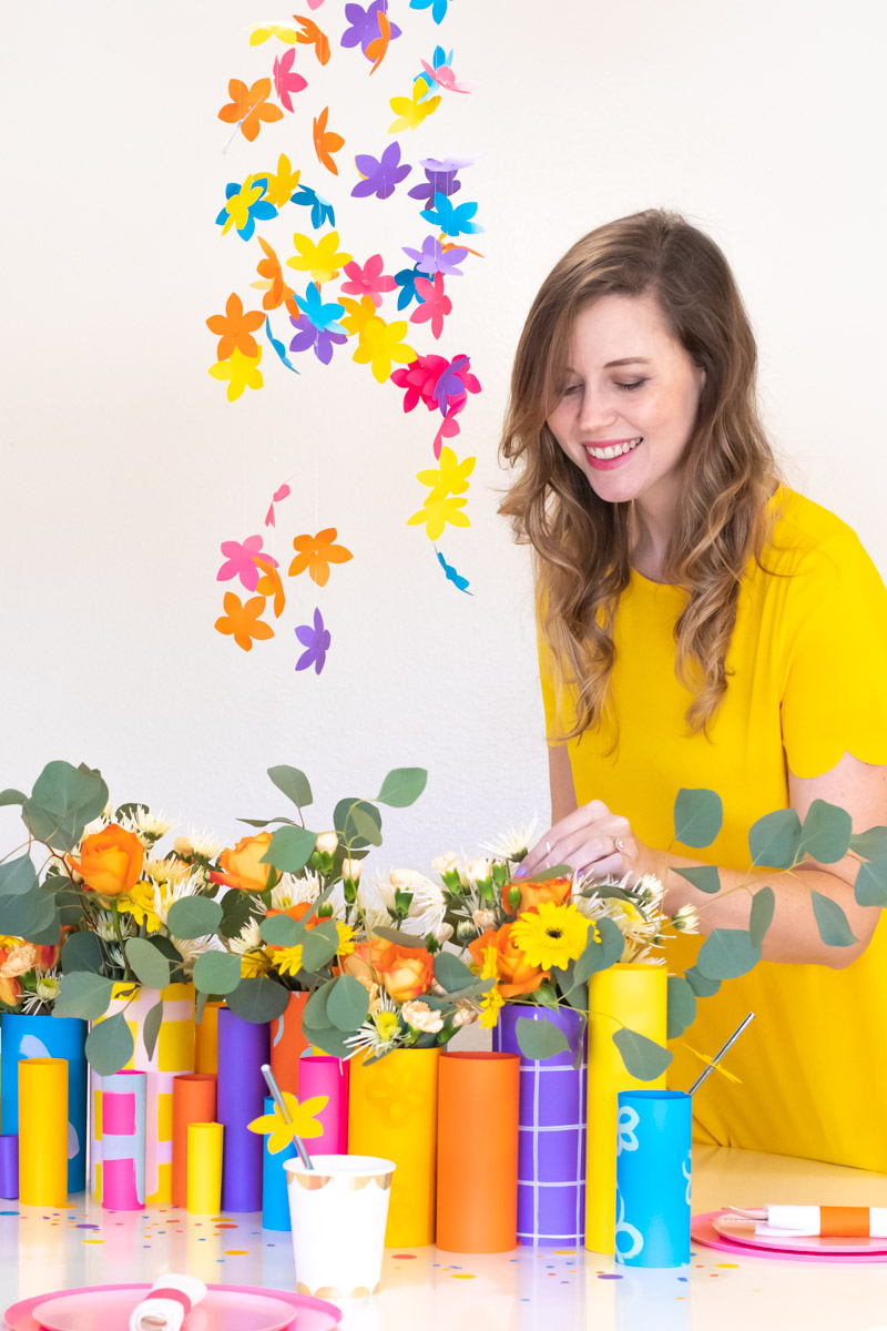Colorful Spring Party with DIY Paper Decor / Use vibrant Astrobrights cardstock to create a variety of paper party decor for a spring celebration! Whether you're celebrating a Mother's Day brunch, bachelorette weekend or just-because party, thes bright spring party ideas will POP! Make paper wrapped vases as a unique centerpiece accompanied by a paper floral chandelier, floral straws, paper napkin rings and simple homemade confetti #ad #partyideas #springdecor #papercrafts #diyparty #partydecor #paperparty #paperdecor #mothersday #easterbrunch #rainbowparty #floraldecor #birthdayparty #springparty