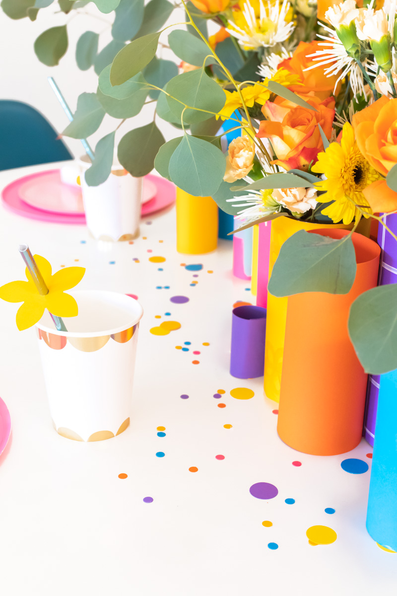 Colorful Spring Party with DIY Paper Decor / Use vibrant Astrobrights cardstock to create a variety of paper party decor for a spring celebration! Whether you're celebrating a Mother's Day brunch, bachelorette weekend or just-because party, thes bright spring party ideas will POP! Make paper wrapped vases as a unique centerpiece accompanied by a paper floral chandelier, floral straws, paper napkin rings and simple homemade confetti #ad #partyideas #springdecor #papercrafts #diyparty #partydecor #paperparty #paperdecor #mothersday #easterbrunch #rainbowparty #floraldecor #birthdayparty #springparty