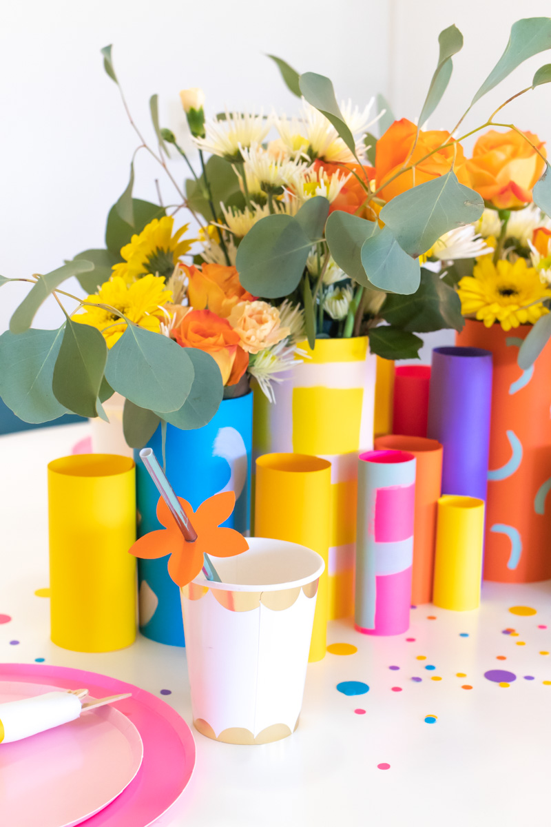 Colorful Spring Party with DIY Paper Decor / Use vibrant Astrobrights cardstock to create a variety of paper party decor for a spring celebration! Whether you're celebrating a Mother's Day brunch, bachelorette weekend or just-because party, thes bright spring party ideas will POP! Make paper wrapped vases as a unique centerpiece accompanied by a paper floral chandelier, floral straws, paper napkin rings and simple homemade confetti #ad #partyideas #springdecor #papercrafts #diyparty #partydecor #paperparty #paperdecor #mothersday #easterbrunch #rainbowparty #floraldecor #birthdayparty #springparty