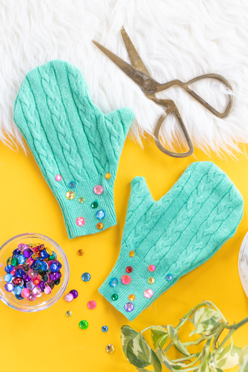 Upcycled Sweater DIY! Easy No-Sew Mittens // This easy upcycling DIY is perfect for giving new life to a thrifted sweater or old piece of clothing! Use a sweater and Aleene's Fabric Fusion to make no-sew mittens perfect for keeping warm this season. Add rhinestones for a little extra bling! #ad #nosew #diyfashion #diystyle #upcycledcrafts #bedazzled #nosewfashion #winterdiy #thrifteddiy