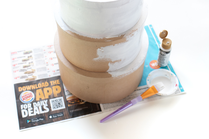 Tiered Cake Card Box DIY // DIY Wedding Card Box // Stack mache boxes into a tiered cake shape with the middles cut out to create a faux cake DIY card box that's perfect for weddings and events! This easy wedding DIY is the perfect way to customize your gift table #weddingdiy #papercrafts #mache #cakedecorating #diywedding #handmadewedding #cardbox
