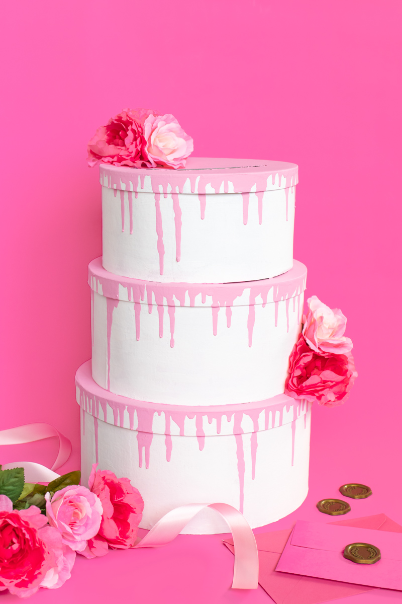 Tiered Cake Card Box DIY // DIY Wedding Card Box // Stack mache boxes into a tiered cake shape with the middles cut out to create a faux cake DIY card box that's perfect for weddings and events! This easy wedding DIY is the perfect way to customize your gift table #weddingdiy #papercrafts #mache #cakedecorating #diywedding #handmadewedding #cardbox