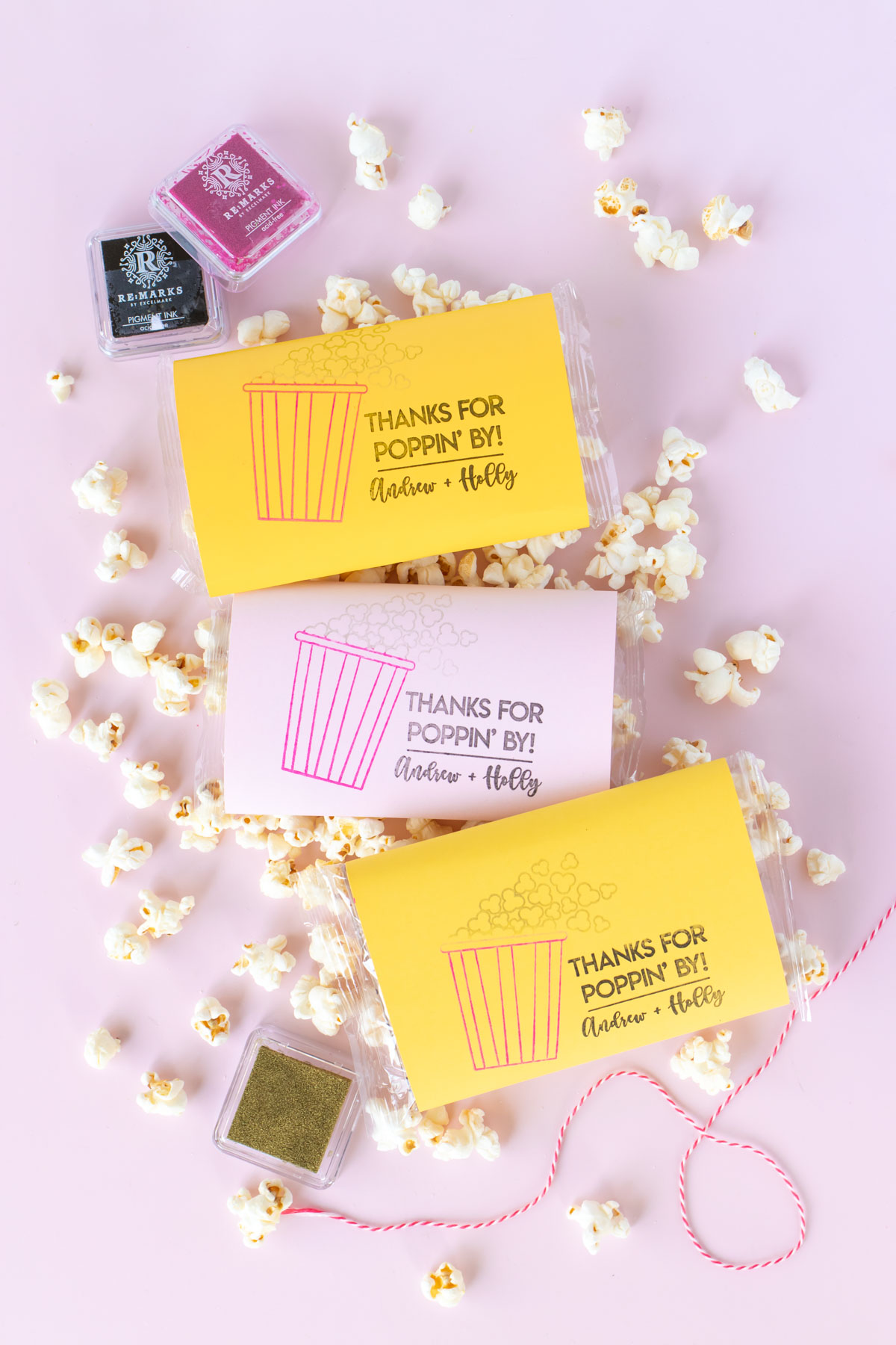 DIY Stamped Popcorn Favors for Weddings | Make your own DIY wedding favors with microwave popcorn! These cute "thanks for POPPING by" popcorn wedding favors use a custom stamp from RubberStamps.com to make a favor guests can easily enjoy at home! #ad #weddingdiy #weddingfavor #partyfavor #stamping #popcorn #papercrafts #diyparty #handmadewedding #colorfulwedding