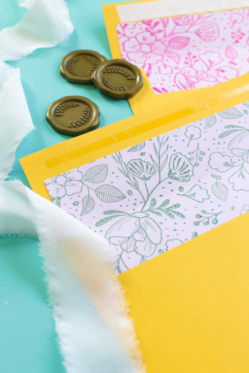 DIY Floral Stamped Envelope Liners // Make DIY wedding stationary with these stamped envelope liners using a large floral stamp and inks from RubberStamps.com! Custom envelope liners are the perfect way to make elegant event stationary. Click through for the easy DIY tutorial #ad #weddingdiy #weddingcrafts #papercrafts #stamping #weddingstationary #diystationary #cardmaking #partydiy