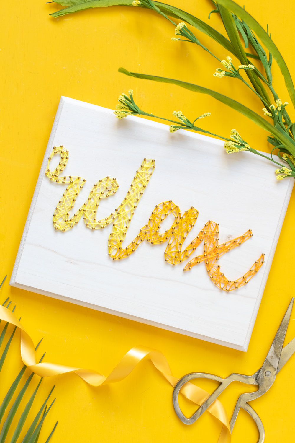 "relax" graphic string art on yellow background