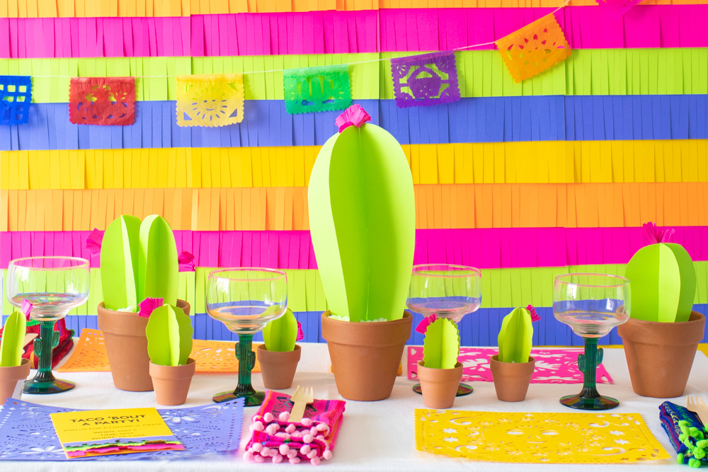 paper fiesta decor with paper cacti, fringe backdrop